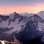 Dawn light bathes the panorama from the Aiguille di Midi