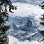Mont Maudit appears through the clouds before an ascent of the Aiguillette des Houches